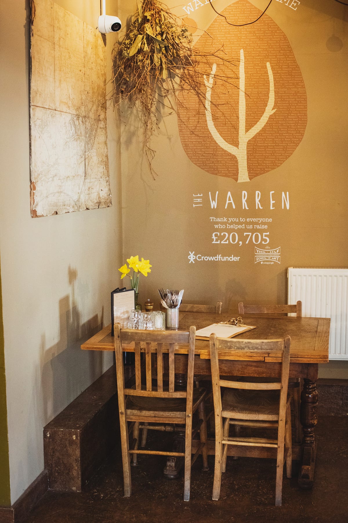 A table laid for dinner in the corner of The Warren's dining room