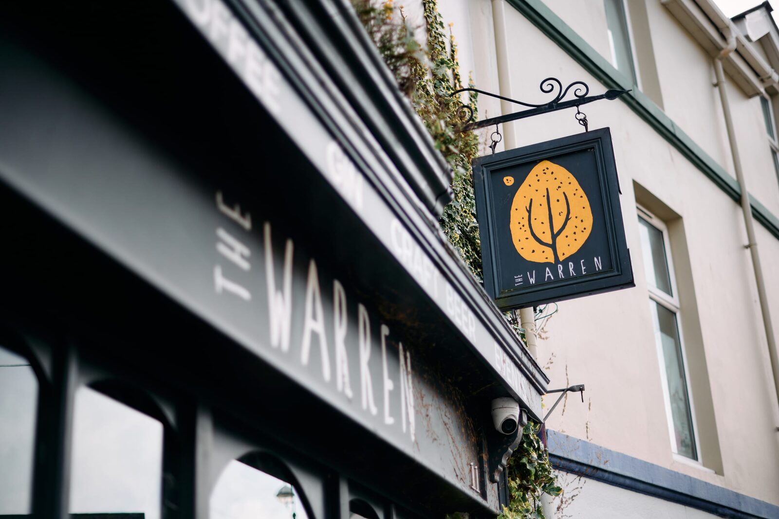 The Warren's hanging sign and shopfront on Mansel Street